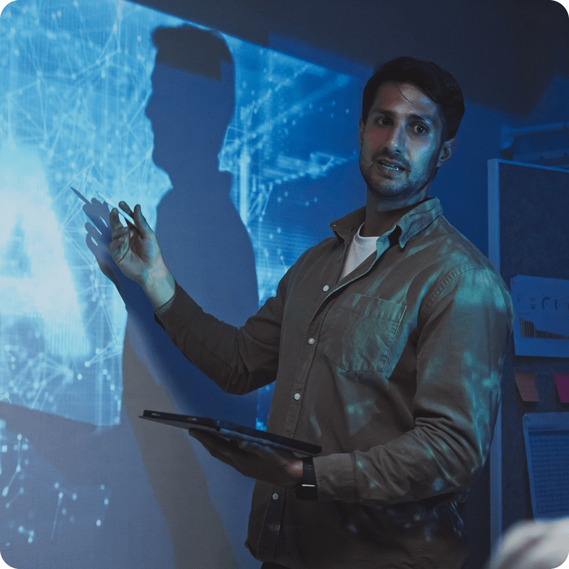 Man presenting digital data on screen